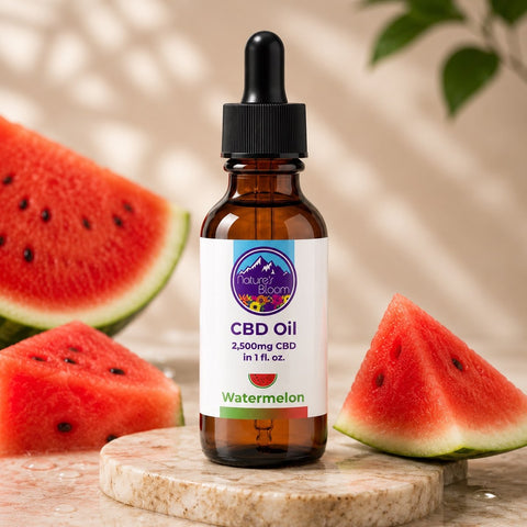 CBD oil bottle with watermelon flavor next to sliced watermelons on a wooden surface.